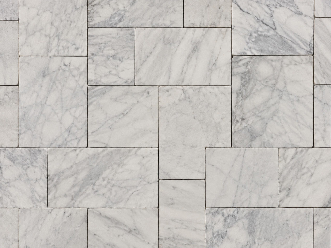 White marble paver driveway with subtle veining