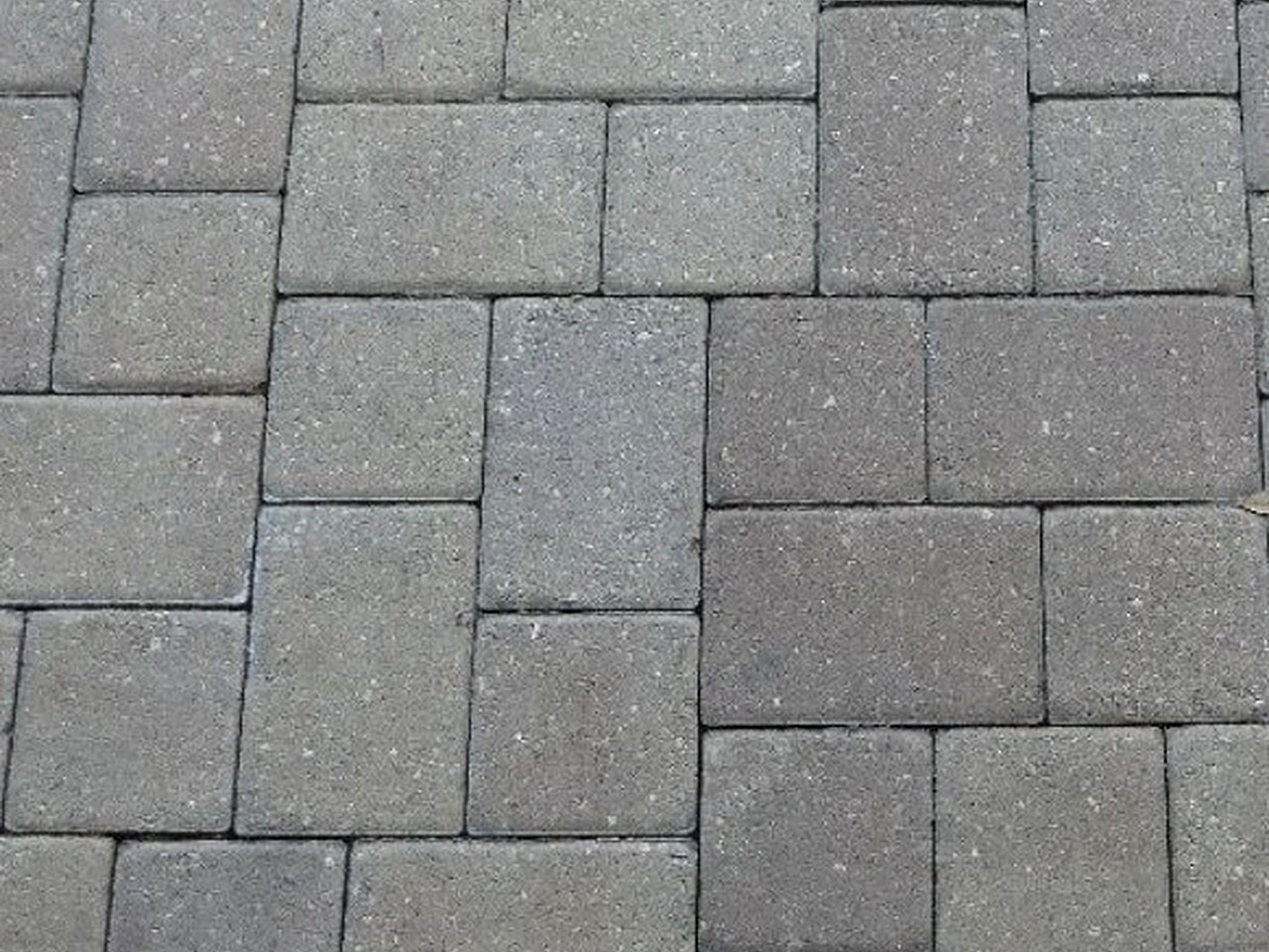 Gray concrete pavers in a modular pattern with tight sand joints, a Boca Raton patio option