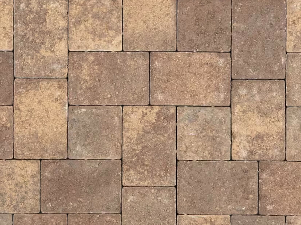 Tumbled brick pavers blending tan, brown, and ochre tones for a Coral Springs project